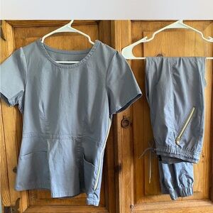Jaanuu Gray Scrub Set with gold detail Zippered Pockets